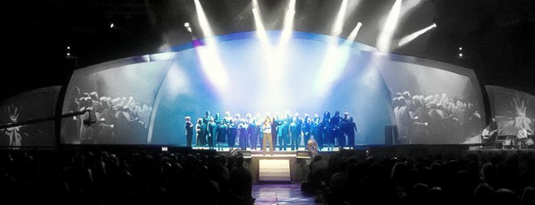 Performers singing on stage
